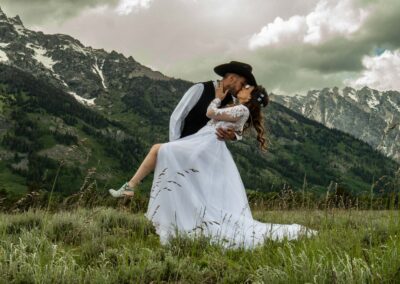 Elopement video or photography in the Colorado mountains. Cowboy hat and wedding dress.